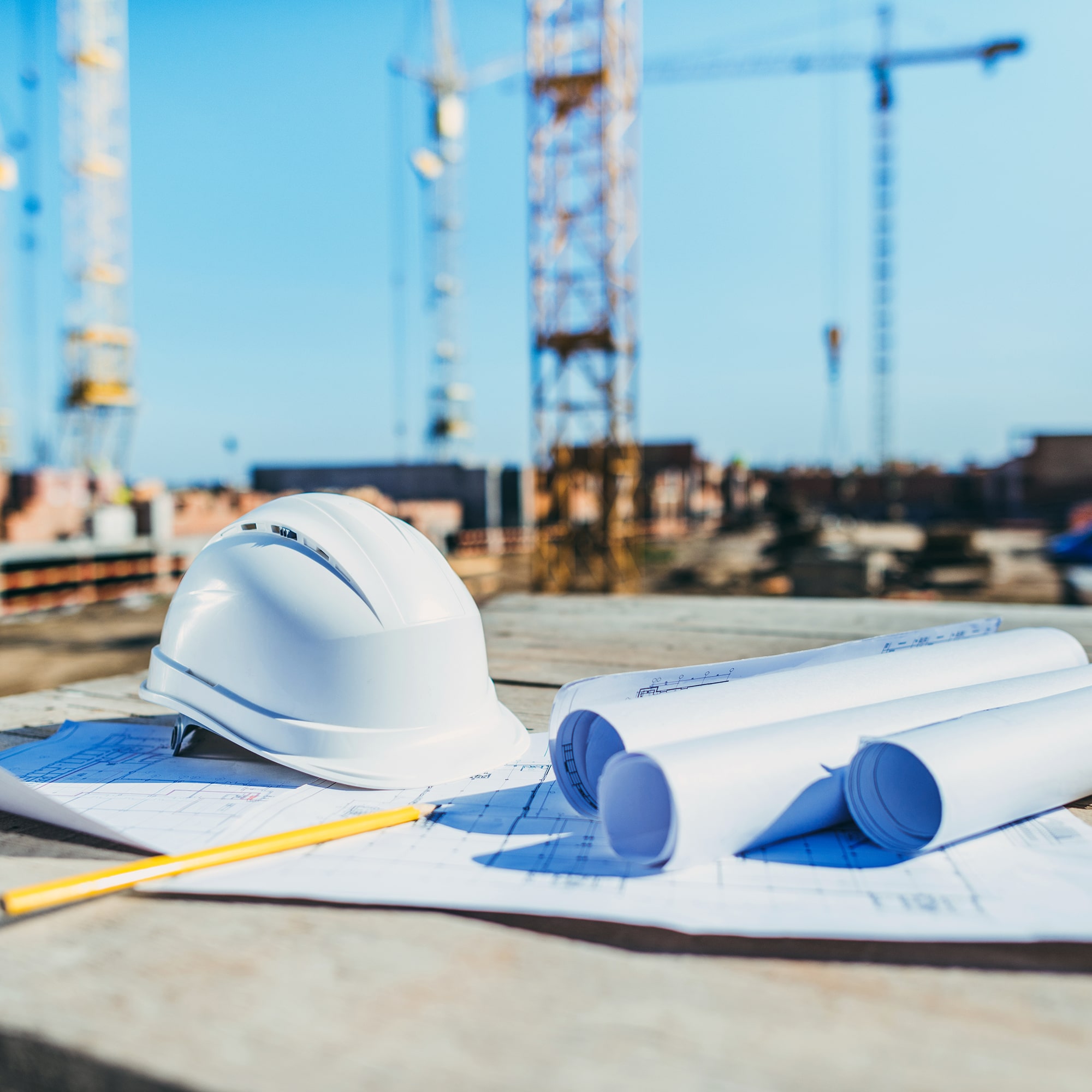 GE_Industries_Construction_close-up-shot-of-rolls-of-papers-with-building-pla-2022-12-16-21-20-55-utc-min